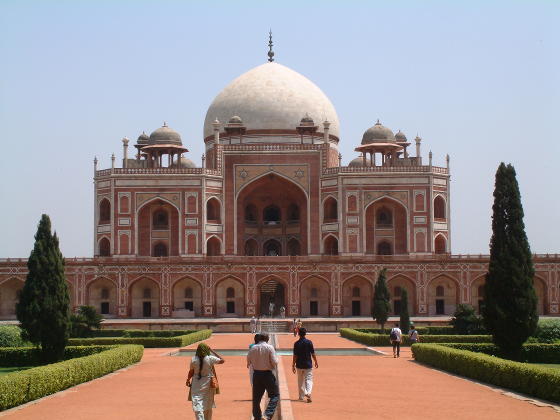 A building looking like a smaller version of the Taj Mahal in white and red brick